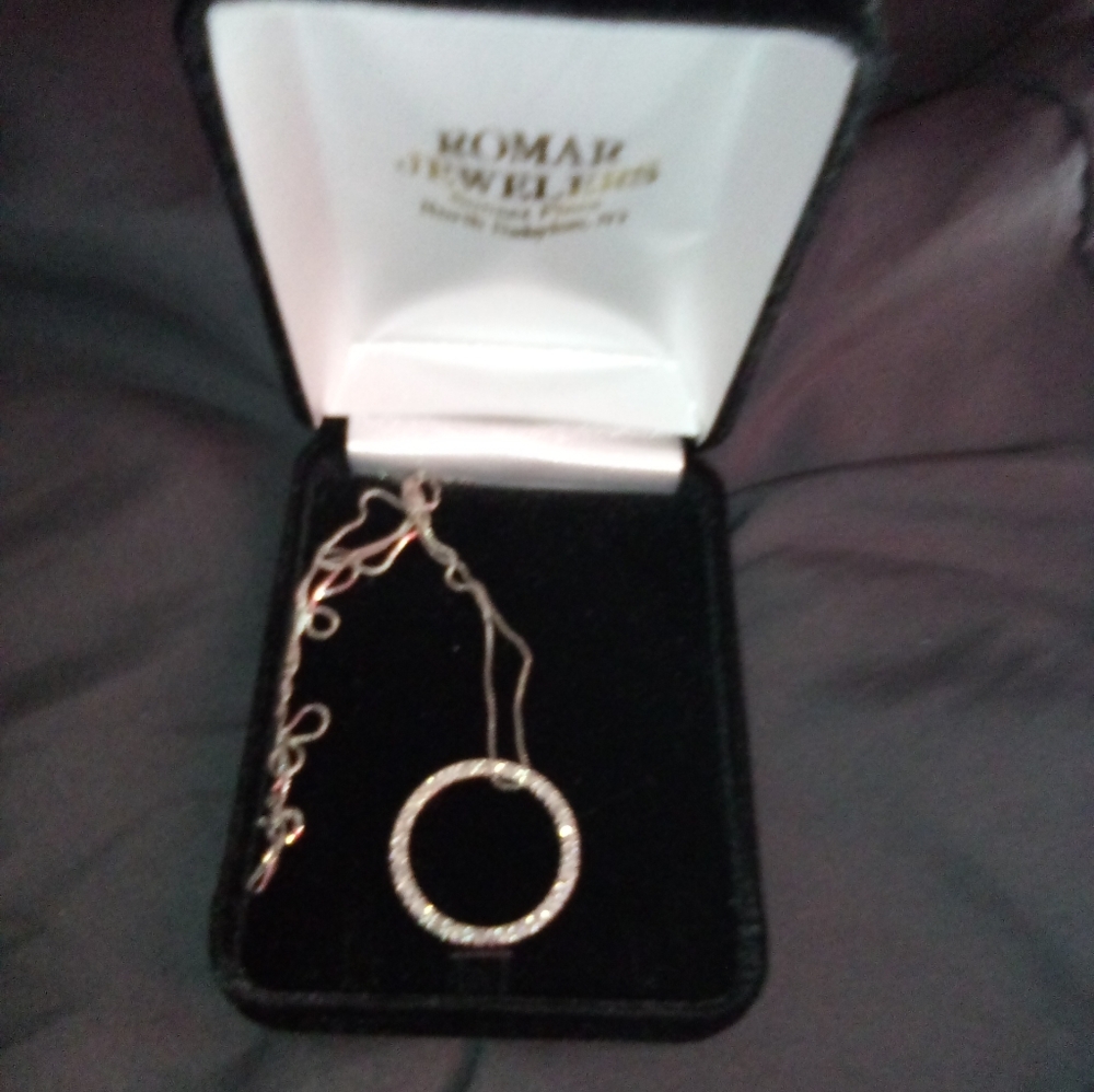 Circle pendant with real diamonds around